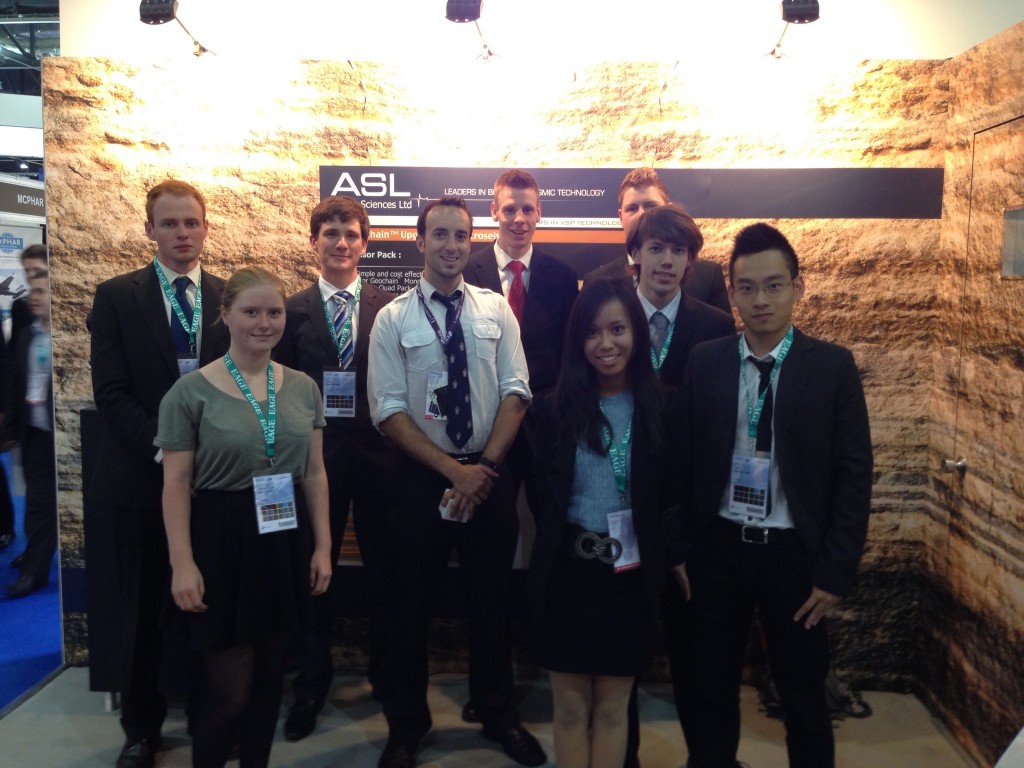 University Students visiting our booth and learning about borehole seismic.